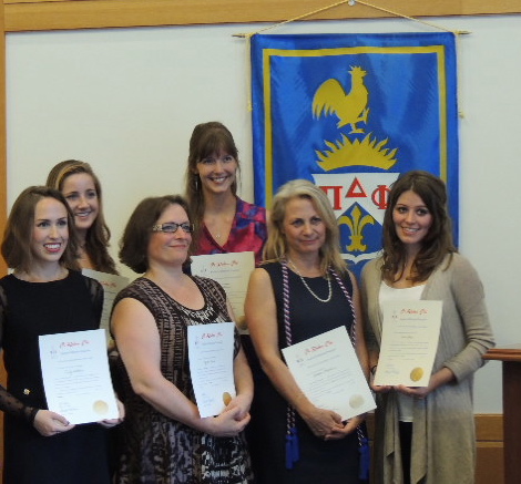 Students being initiated to Pi Delta Phi.