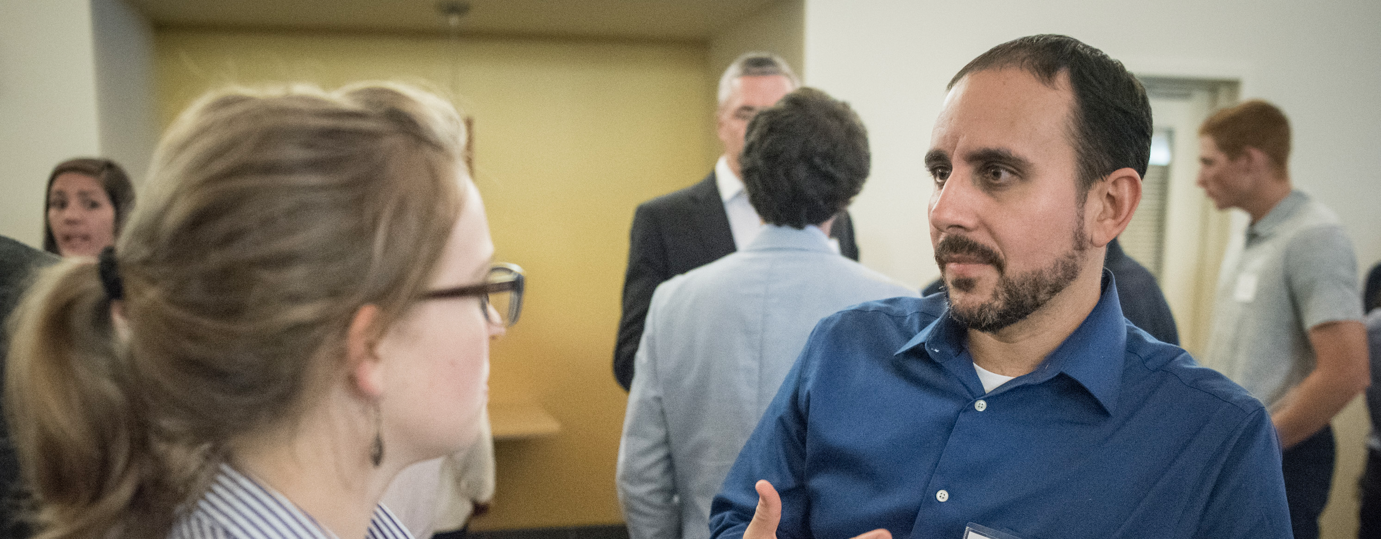 Two people talking at a networking event