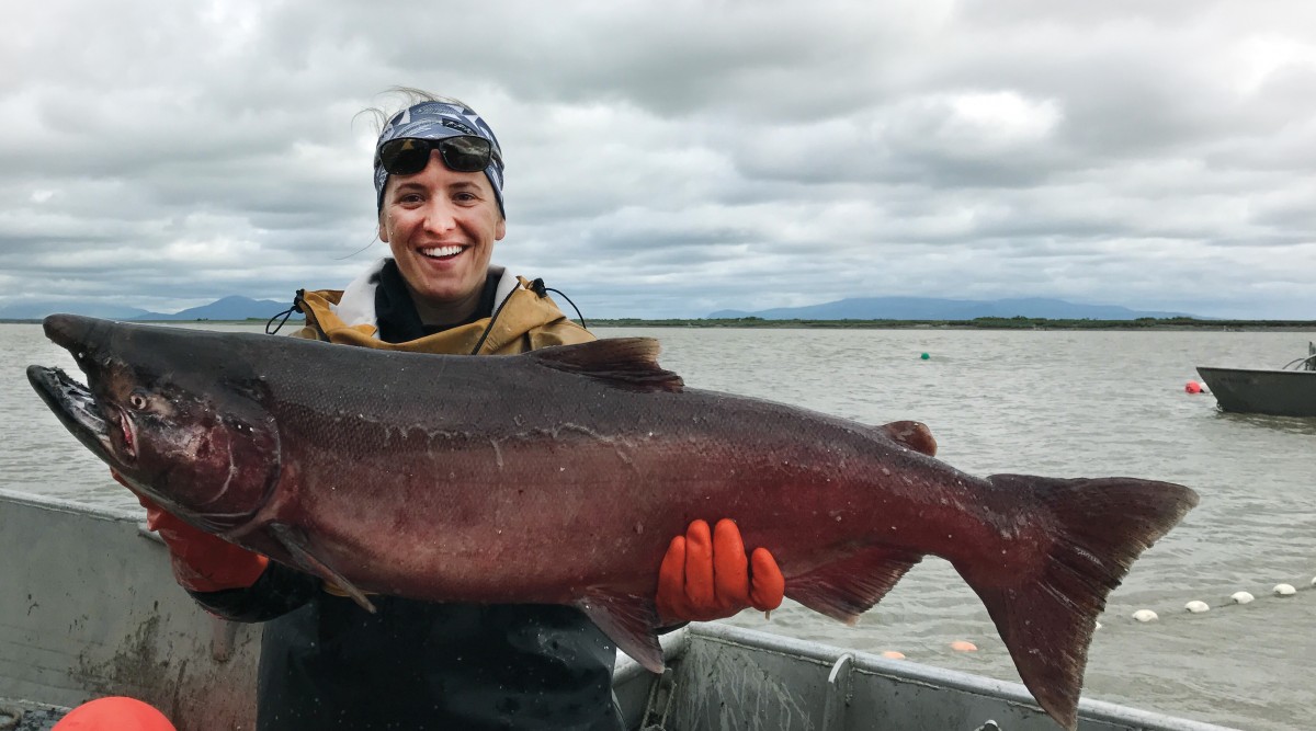 swimmer carrying fish