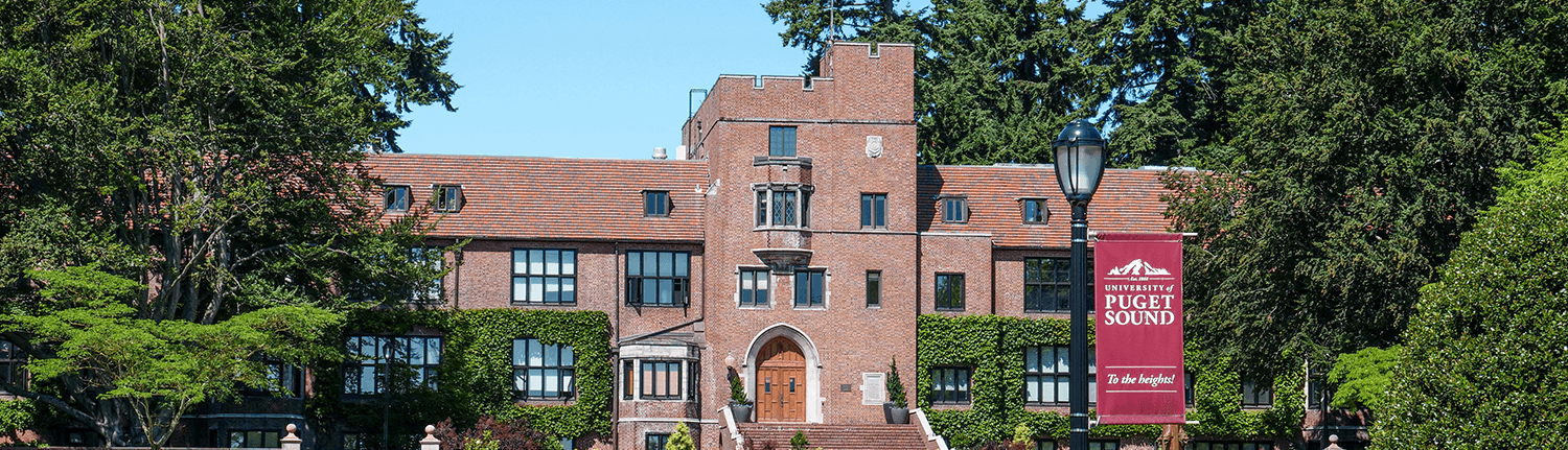 Image of Jones Hall with the university banner off-right.