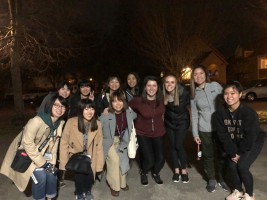 A group of people crouching for a photo