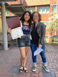 Joshiery Torres receiving DeMarais award from Stacey Weiss