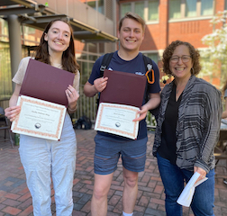 Stella Dahms-May and Mael Bradley receiving IA award from Stacey Weiss