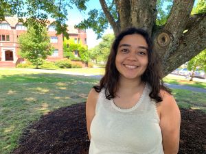 Public Health student Anna Chacon beside the McIntyre building on PS campus.