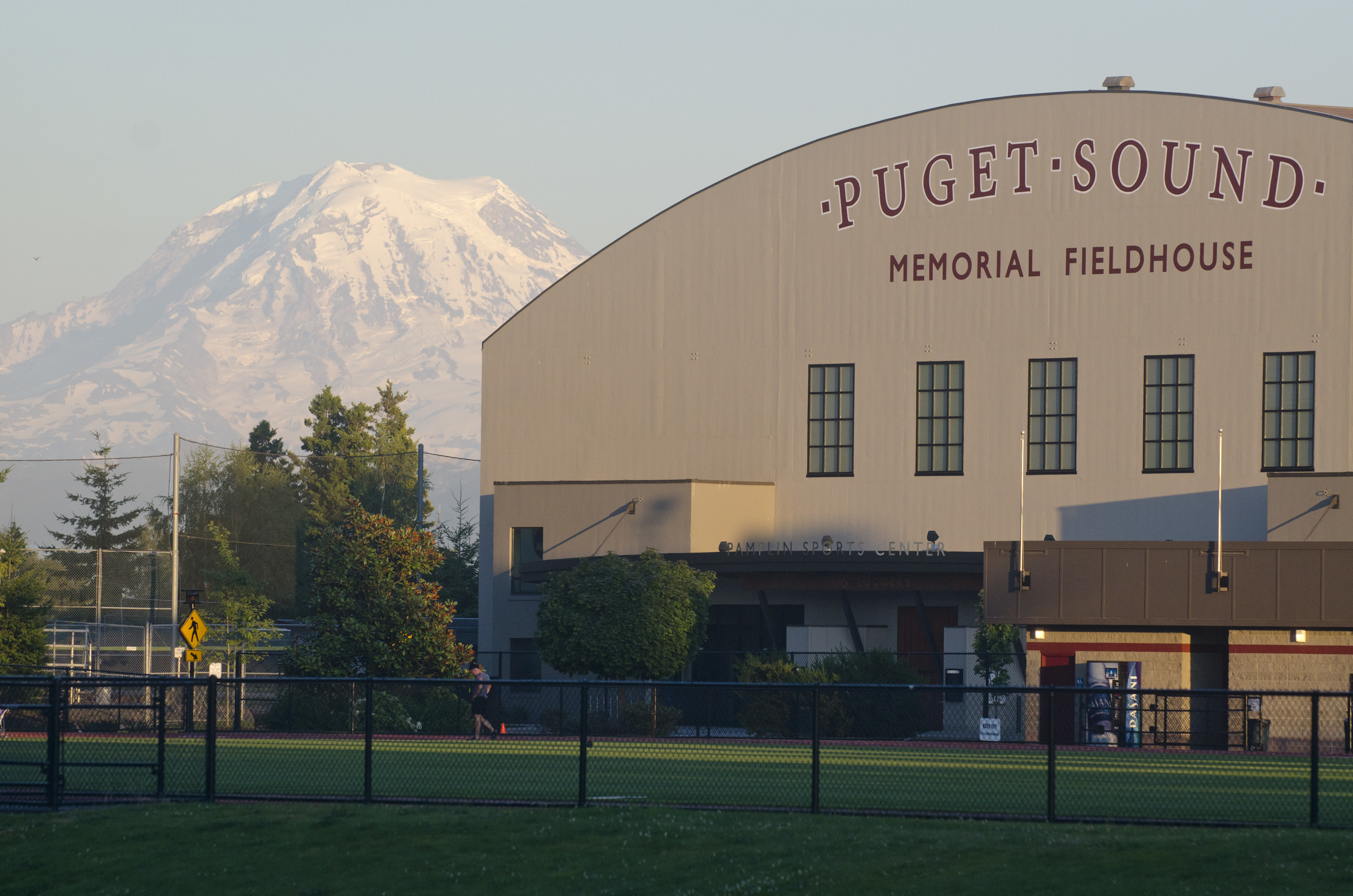 Exterior view of Memorial Fieldhouse with Mt. Rainier in the background. 