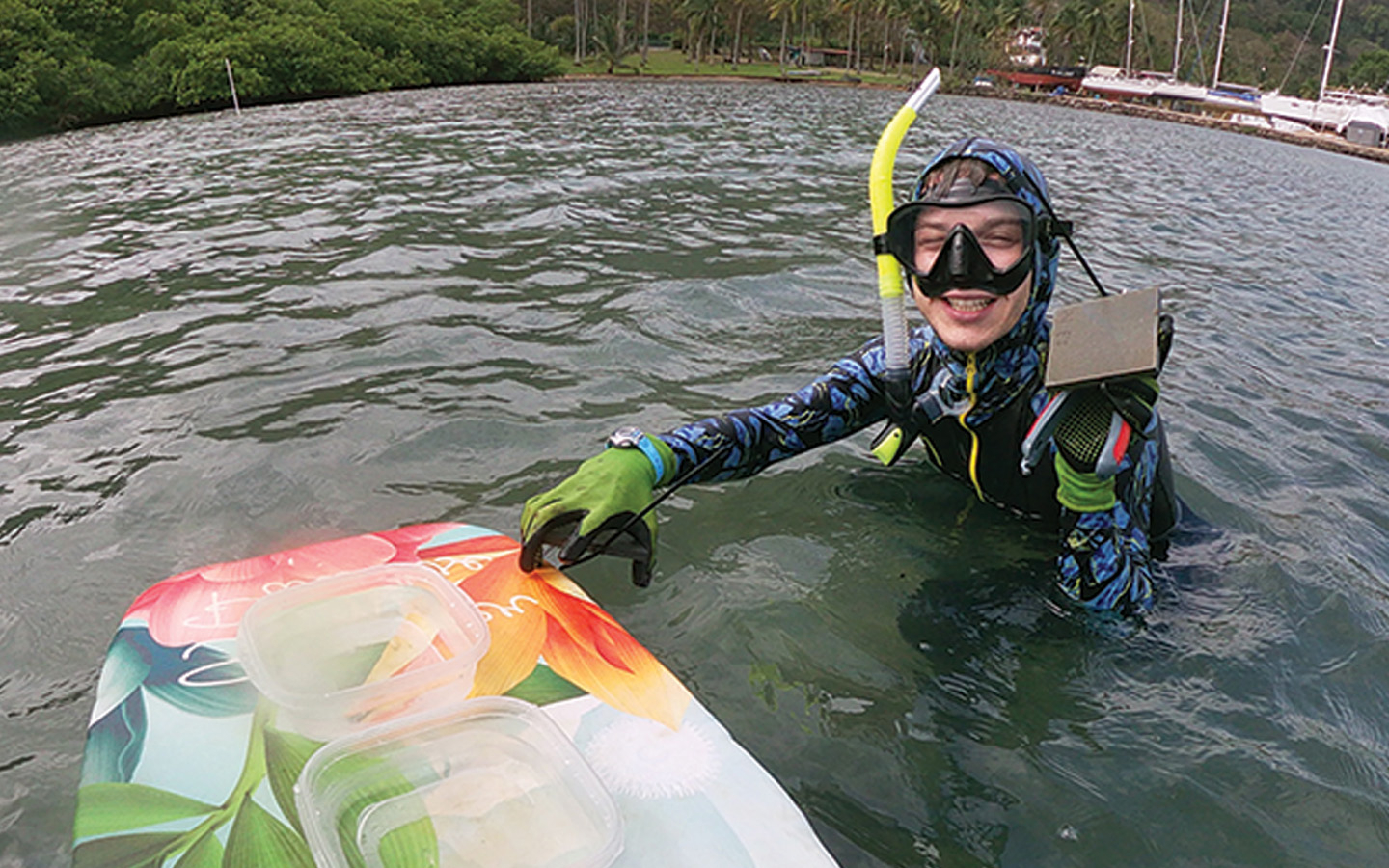 Student in water wearing snorkeling gear