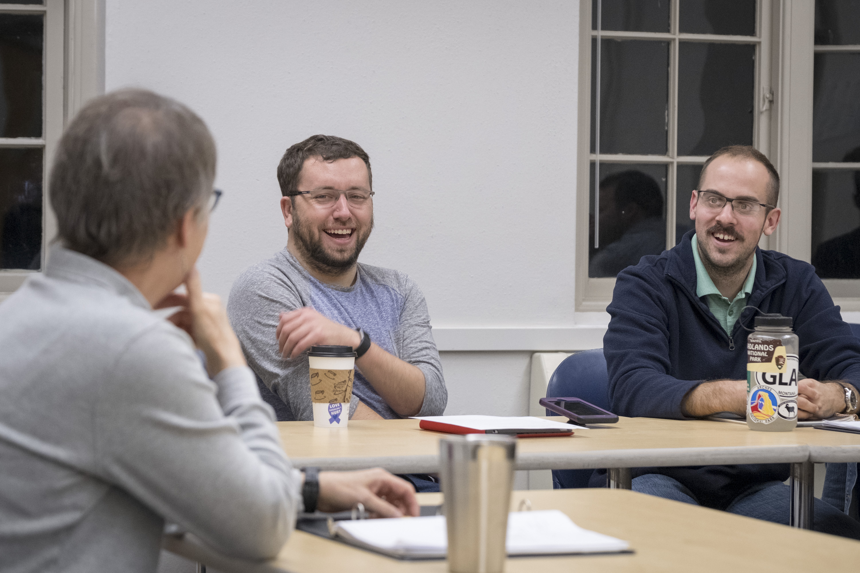 Master of Education in Counseling students engaging in class discussion with their professor.