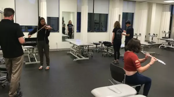 Musicians with their instruments in the Physical Therapy clinic