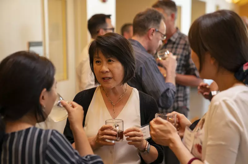 Faculty members chatting at the Fall Faculty Dinner 2022