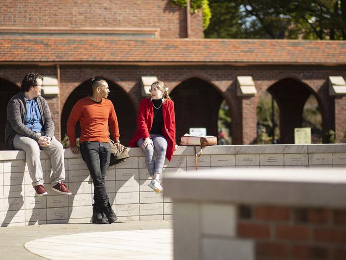 Students sitting at Benefactor Plaza