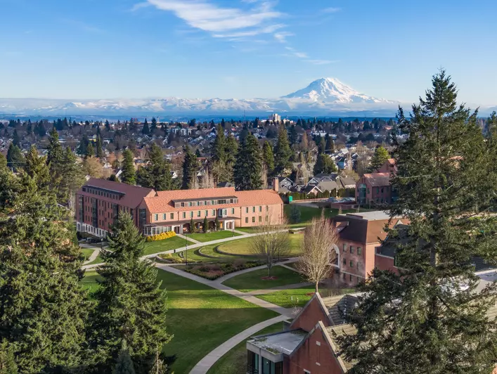 Aerial image of campus with Mount Rainier in the background.