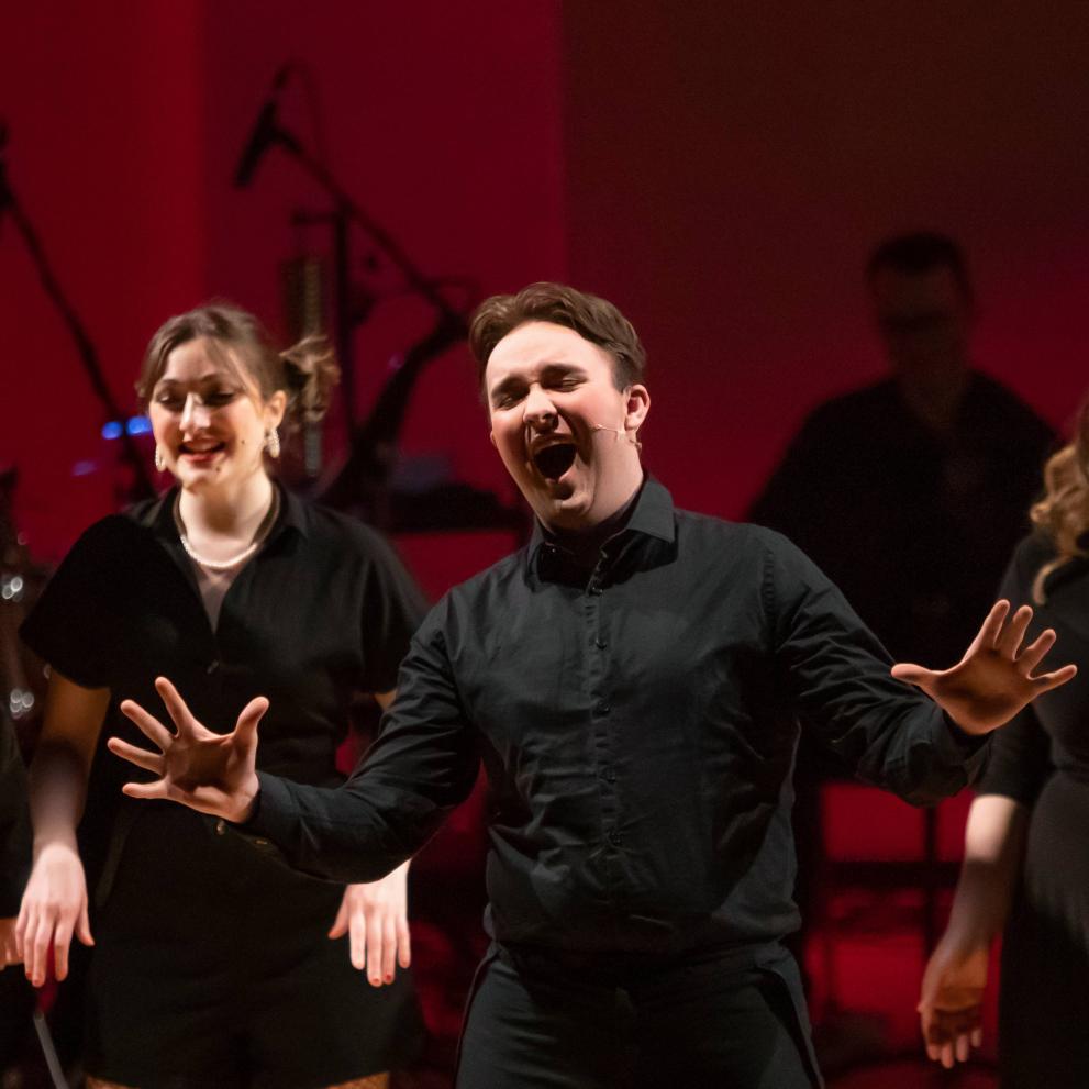 Students singing on stage