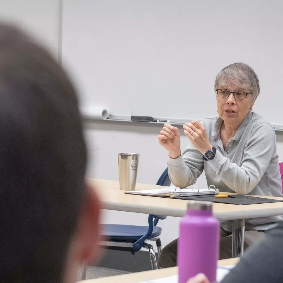 A professor leads class discussion.