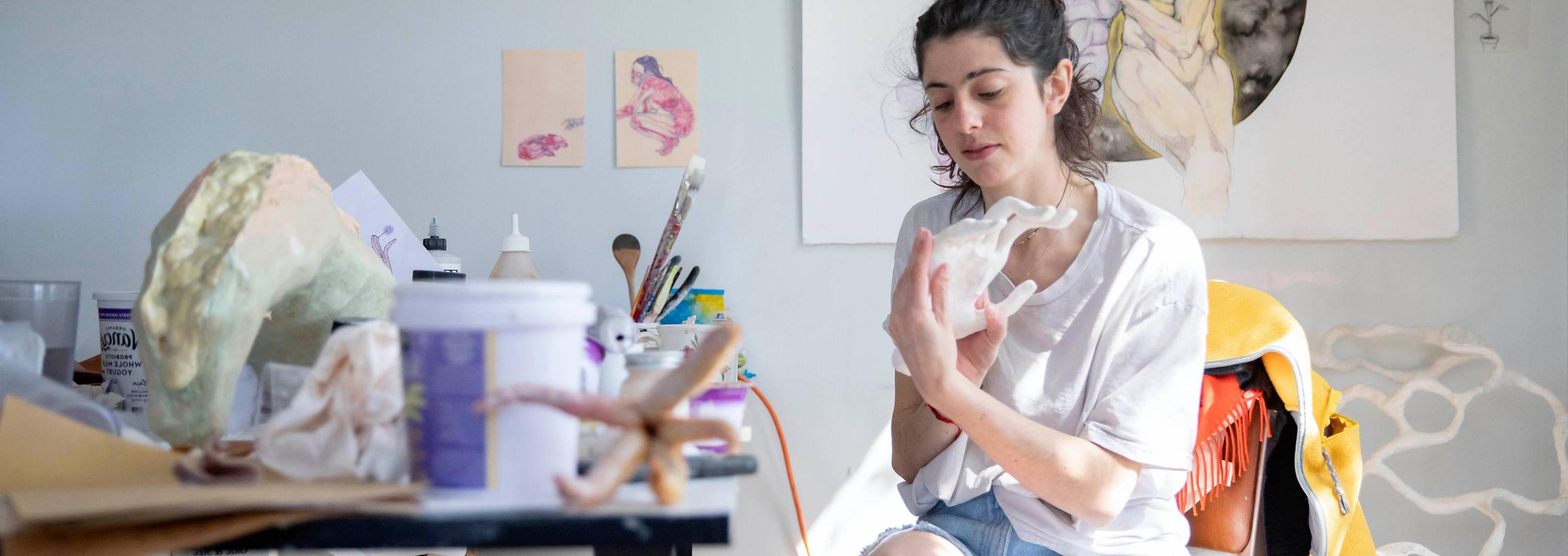 Student works on a ceramics project