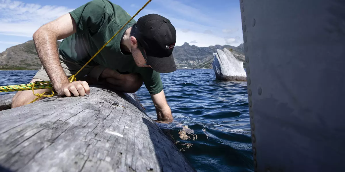 A student conducts research at Spirit Lake near Mt. St. Helens