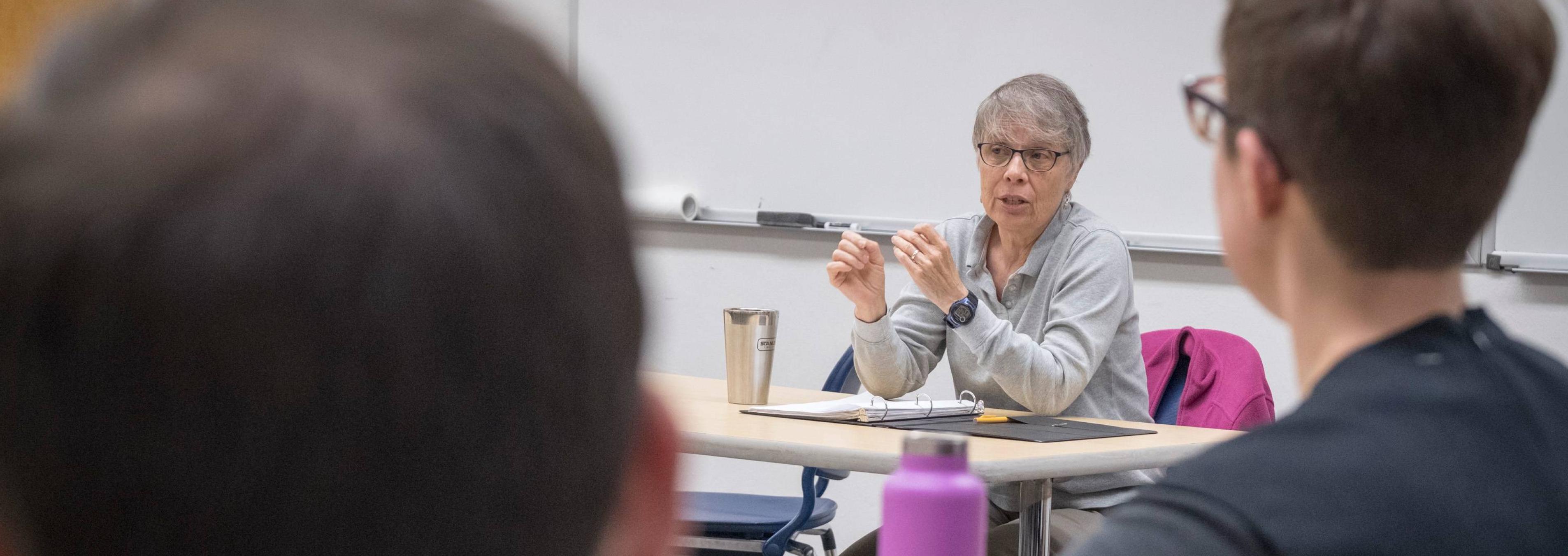 A professor leads a class discussion.