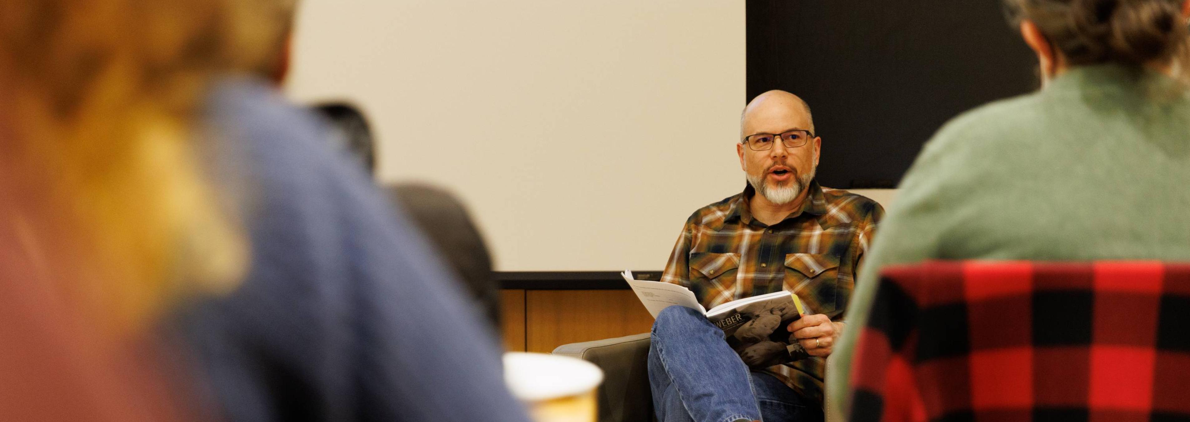 A professor leads a classroom discussion.