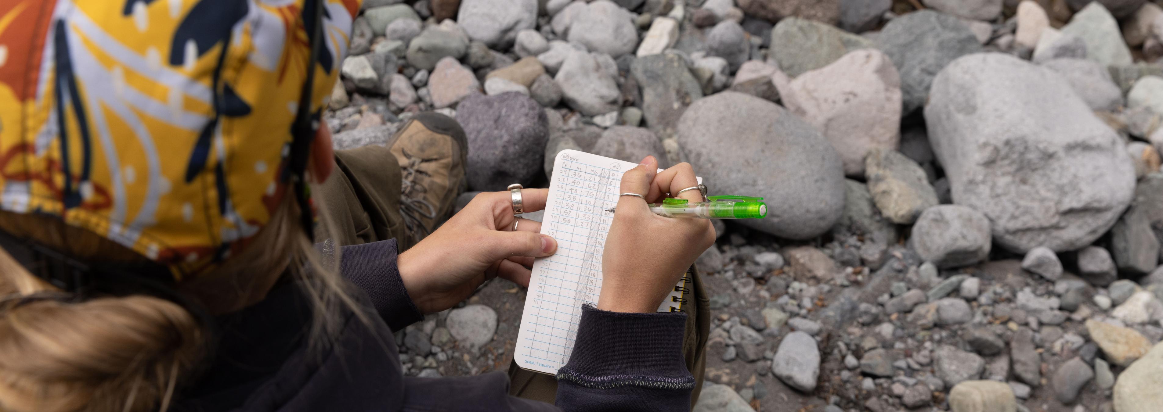 A student does research out in the field.