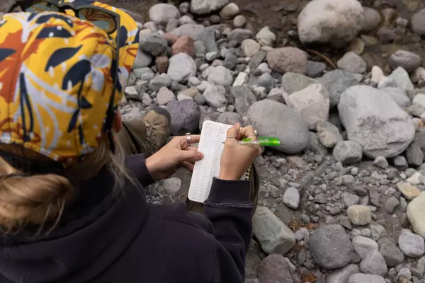 A student conducts research in the field.