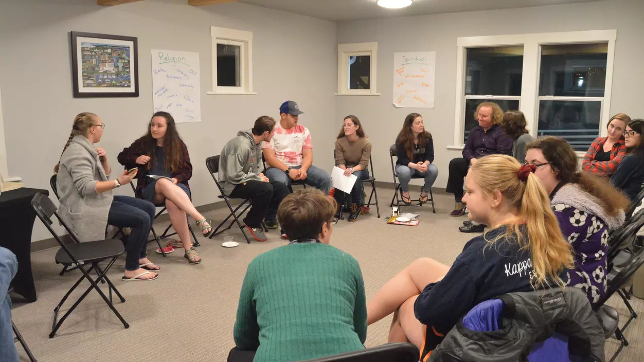 People sitting in a circle, having a discussion