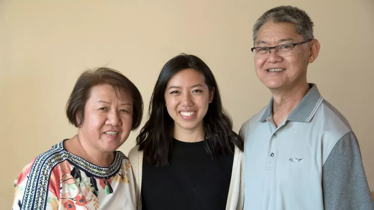 Three people smiling