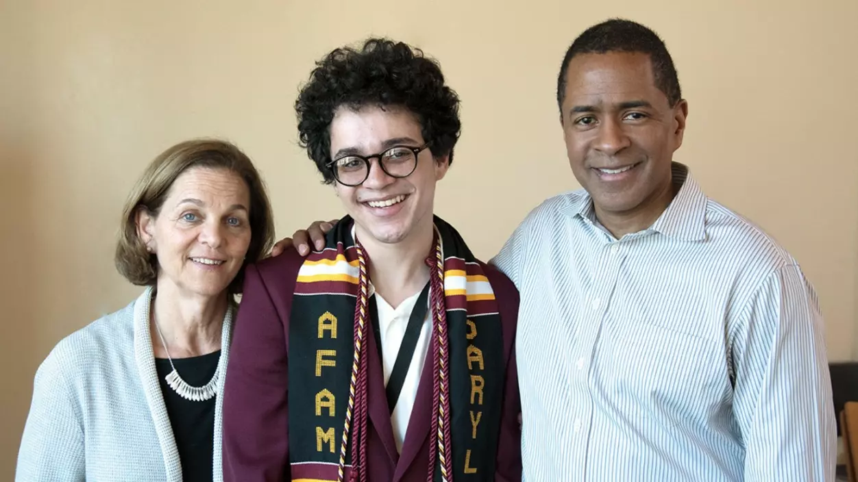 Three people smiling