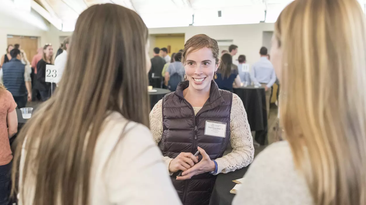 People talking at a networking event