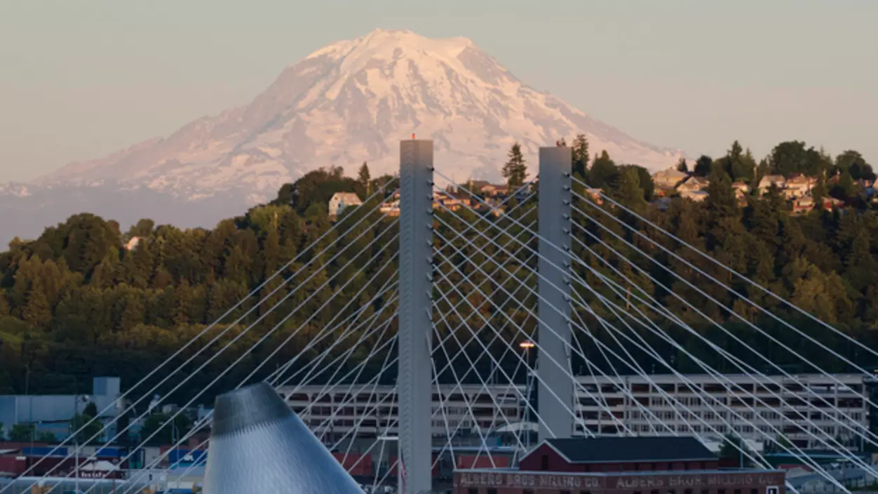 A mountain view with a bridge in the foreground