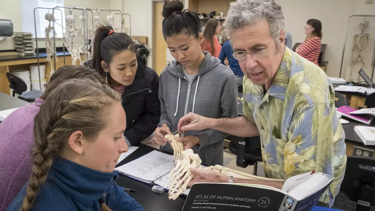 Roger Allen with students in the classroom.