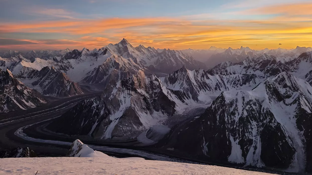 Rugged peaks and glaciers as seen from above.