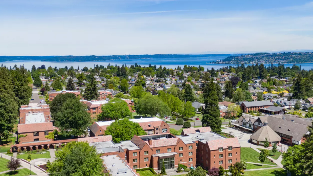 Aerial view of campus with Tacoma's North End and Commencement Bay behind