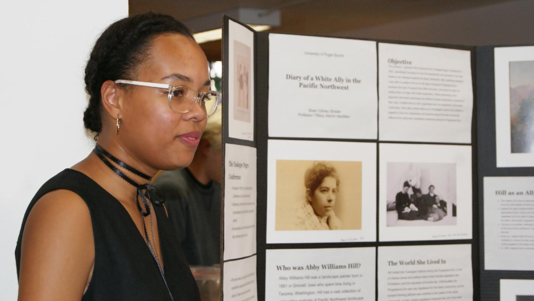 Sloan Strader '18 presents her summer research project at the fall symposium.