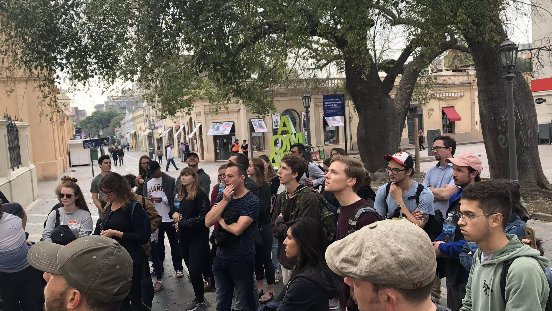 A group of people congregated in a public area