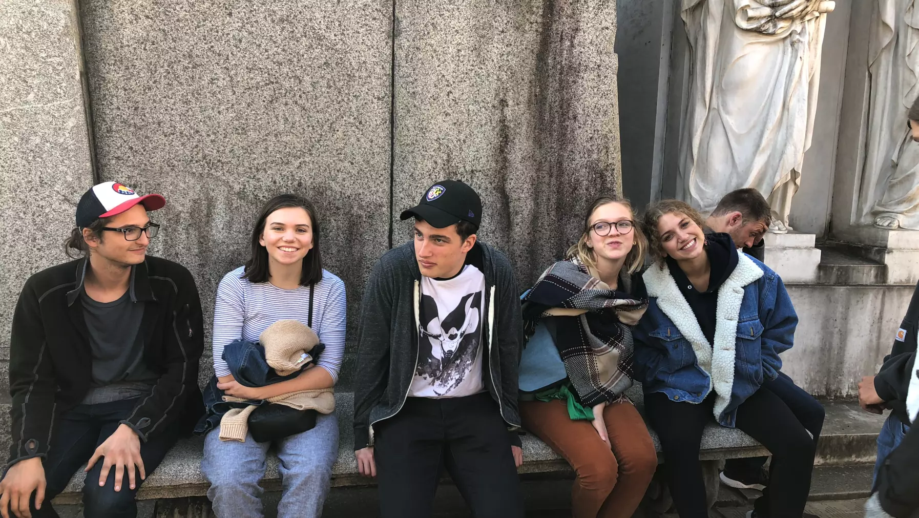 A group of people sitting on a bench