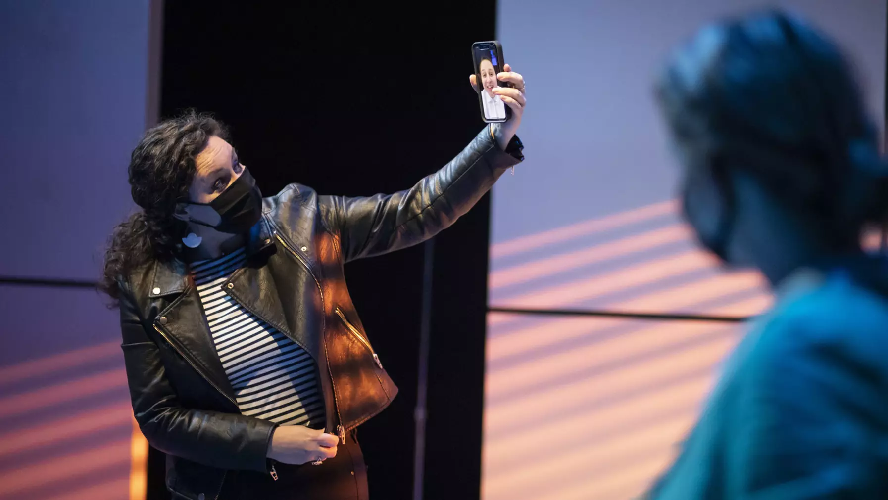 Director, Associate Professor Jess K. Smith ’05, Facetimes with a student during rehearsal of Machinal