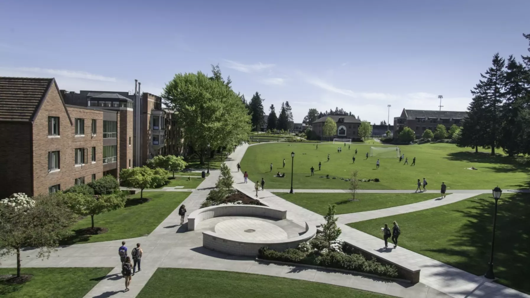 Green space surrounding Benefactor Plaza on a sunny day