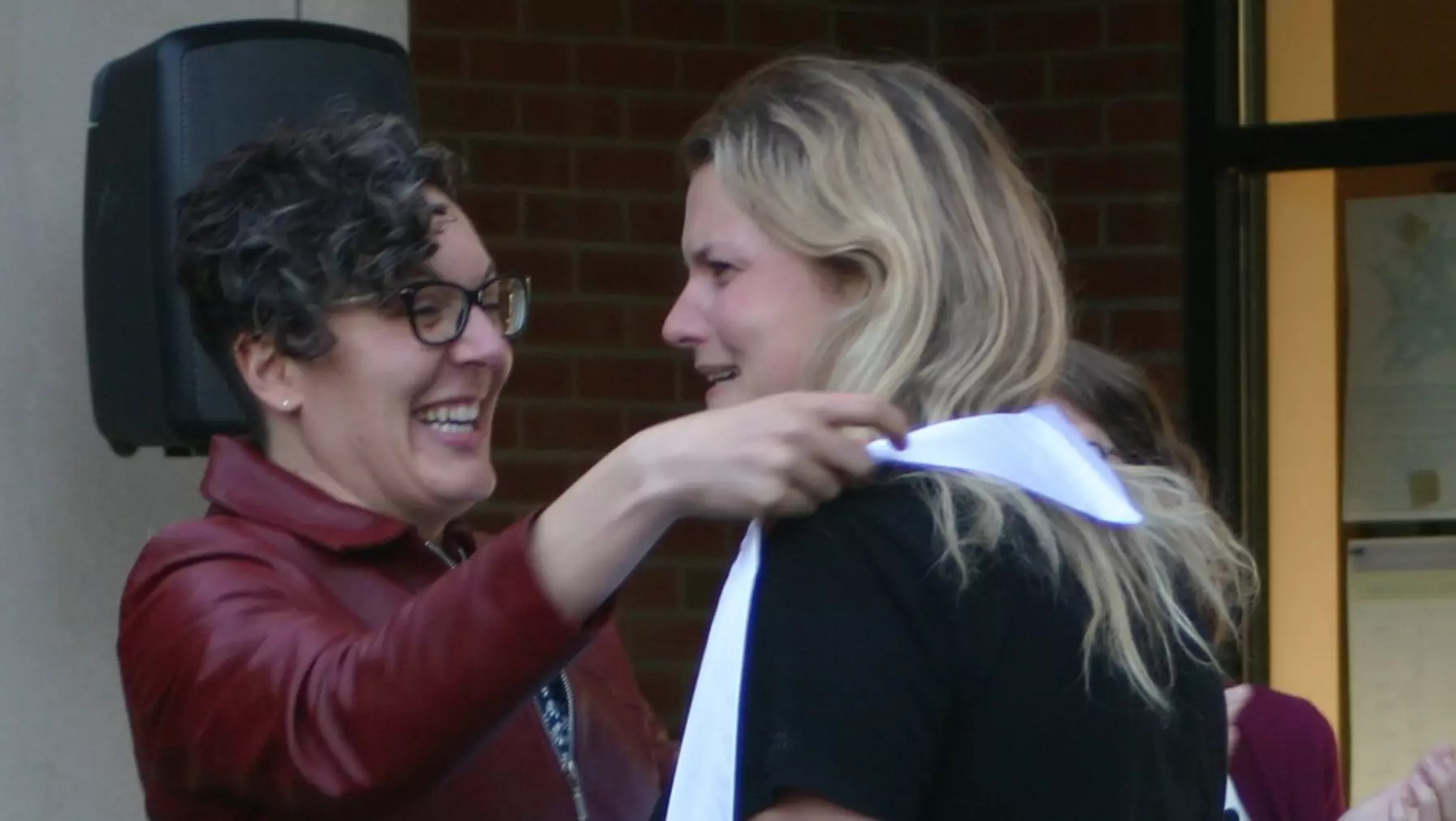 English senior gets her graduation sash.