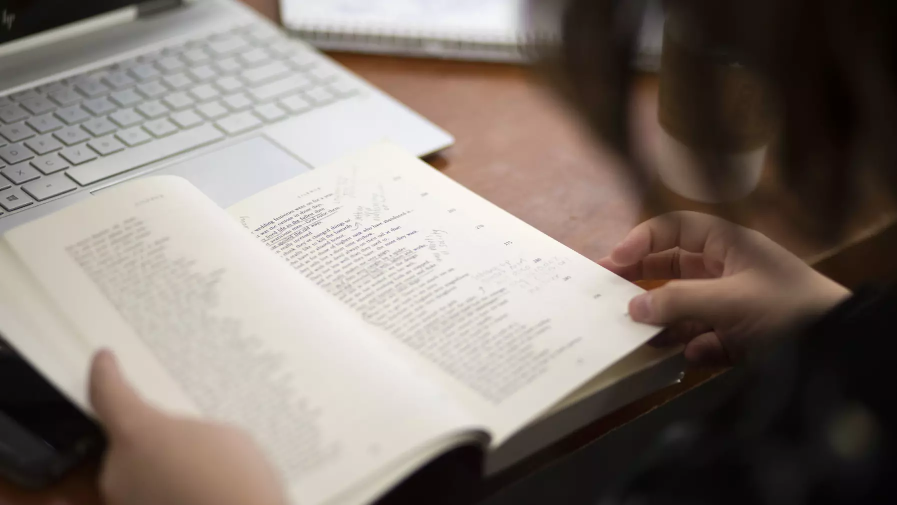 A student studies an open book of poetry