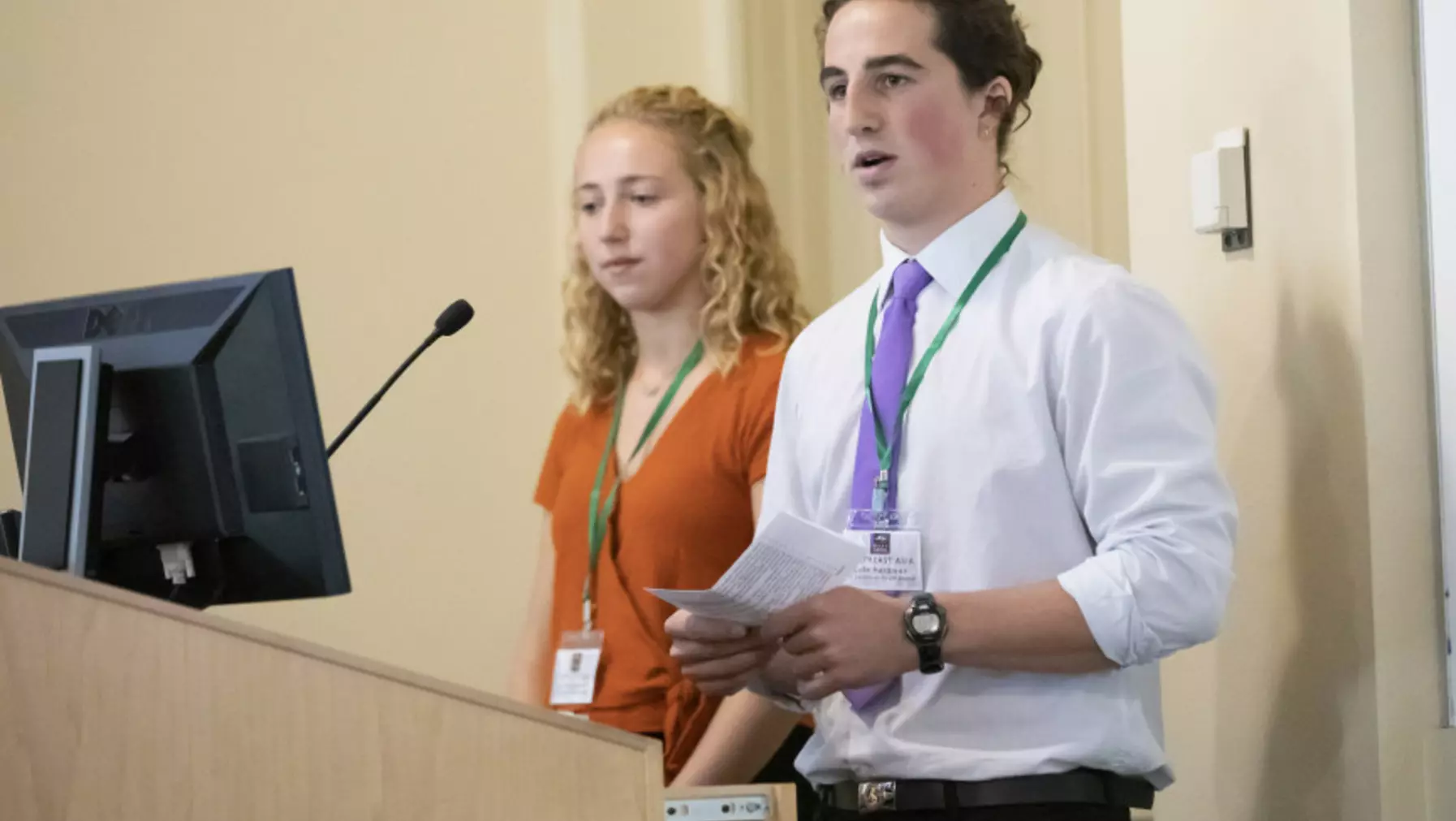 Two people presenting to the audience