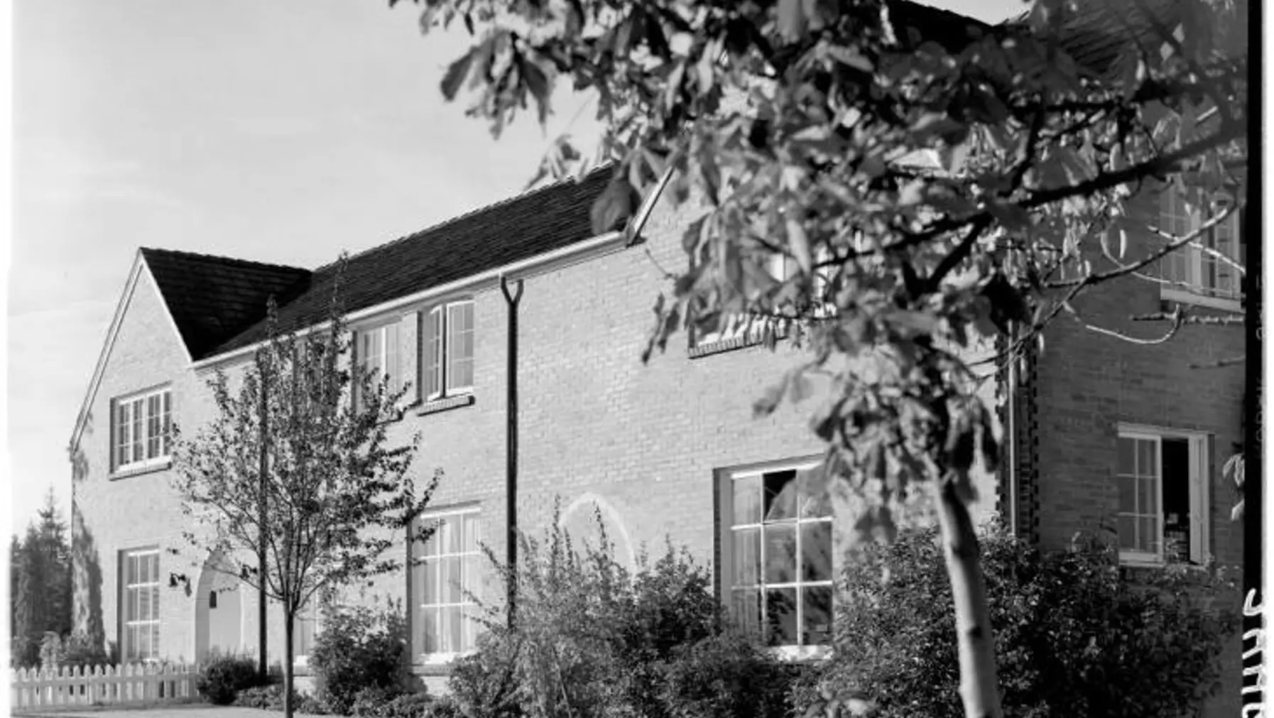 A black and white historical photo of the Kittredge building