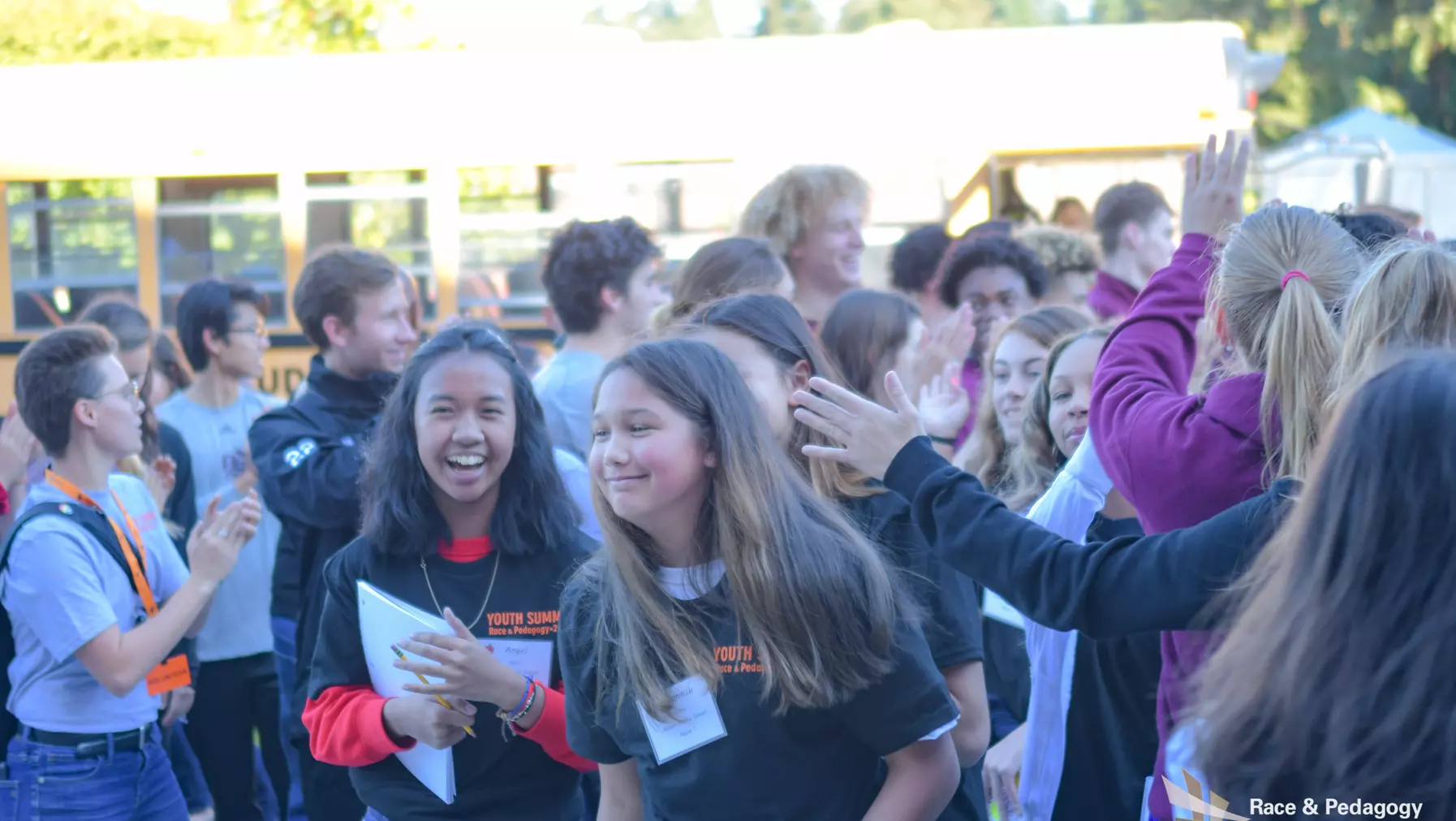 students entering the fieldhouse for the youth summit