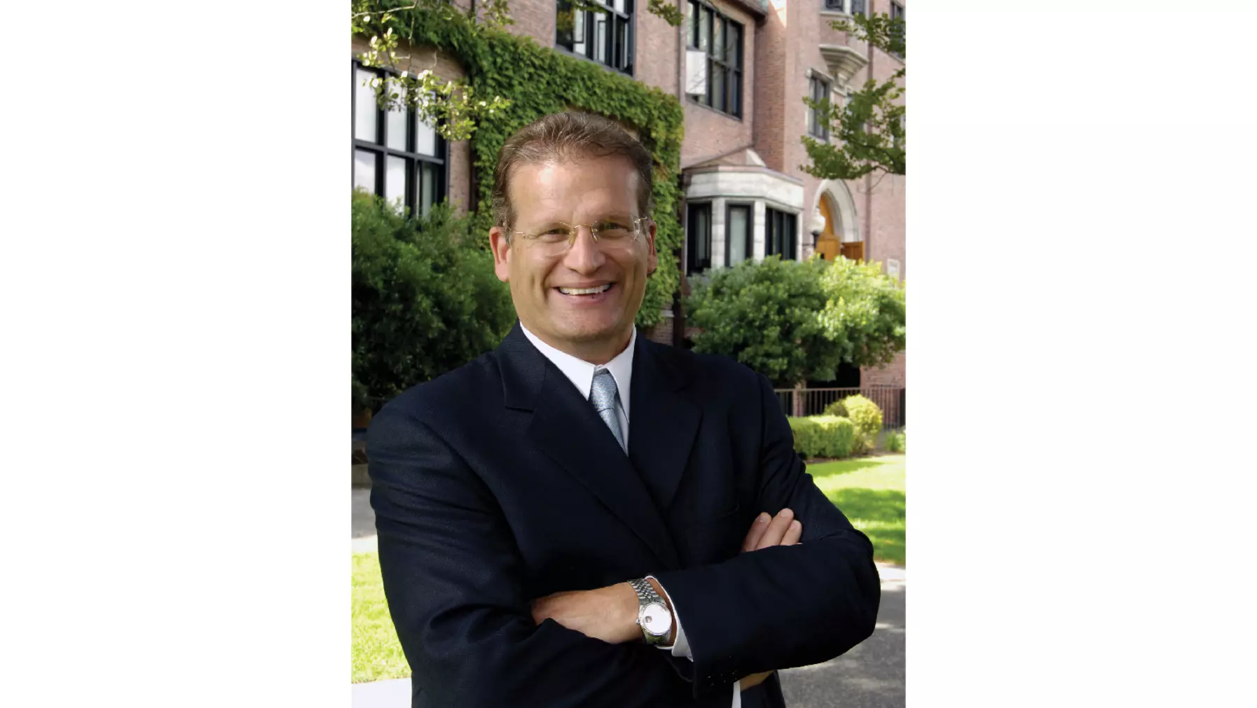 President Ron Thomas smiling on campus.