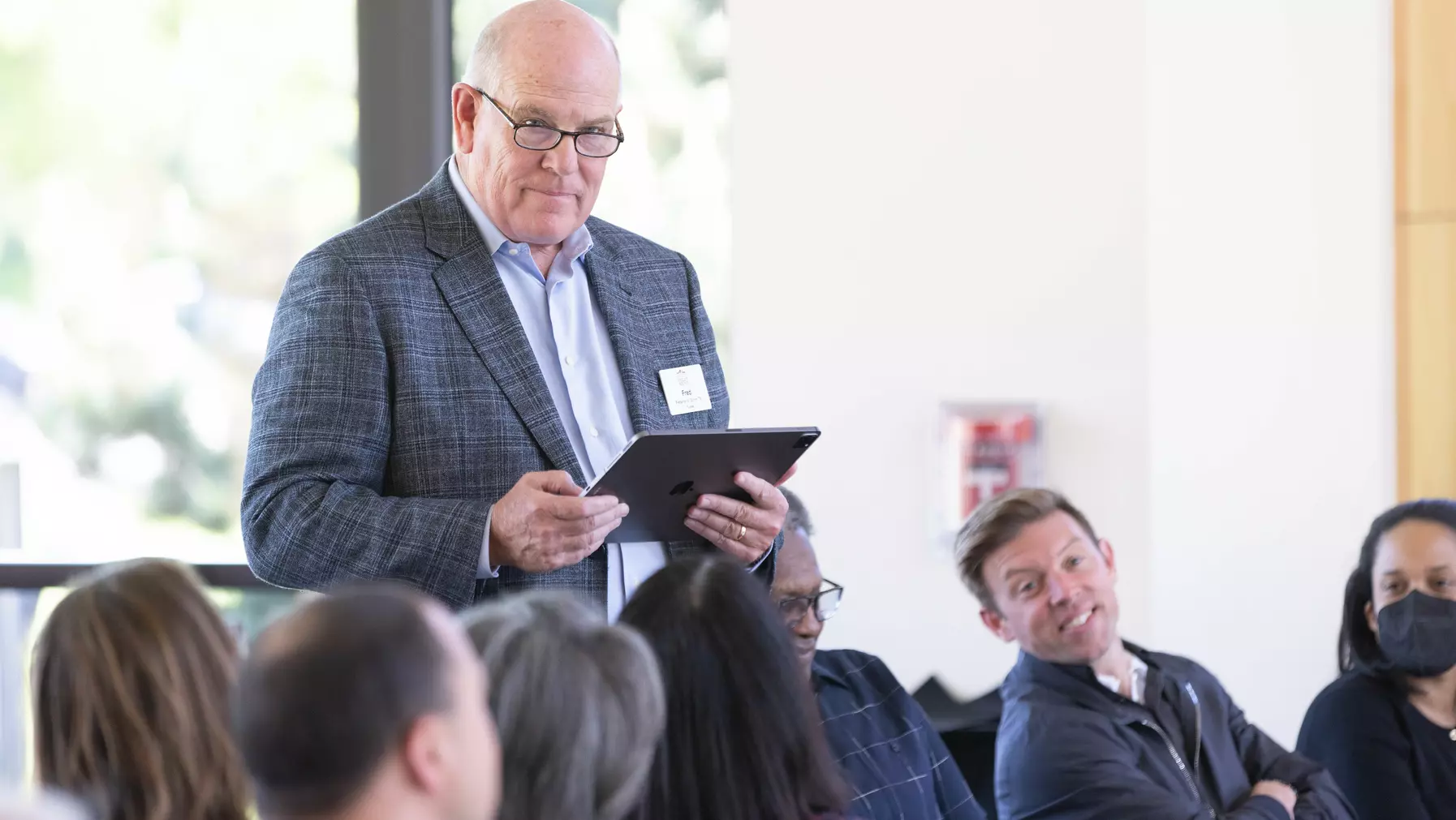 Trustee Fred Grimm '78 shares a poem he wrote to conclude his board service, as trustees Chris Pohlad '07 and Jamilia J. Sherls-Jones '05 listen.