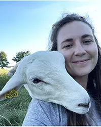 Anna Houston '12 and a wooly friend