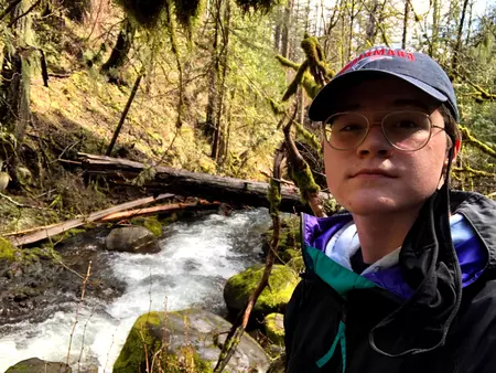 Selfie of Andrew Benoit in front of a creek